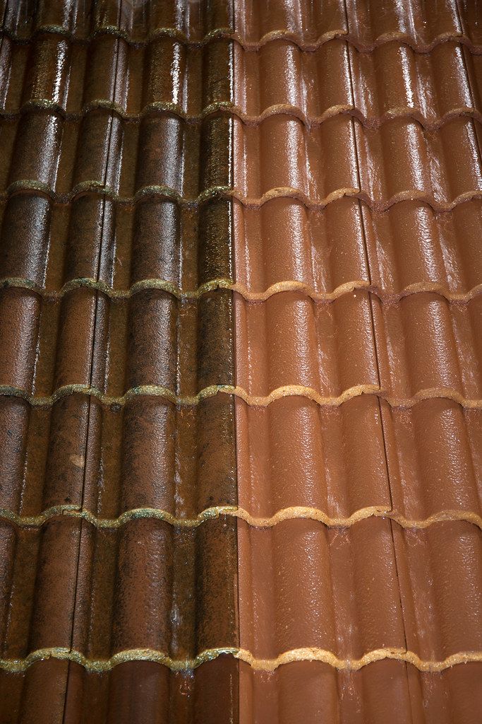 High-pressure surface cleaner removing stains from concrete driveway in Palm Beach County FL